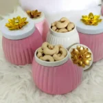 metal jar with golden floral lid handle close up design